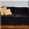 F15. Black velvet loveseat. 26”h x 62”w x 33”d 